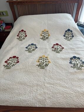 Pottery Barn White Quilt with Red, Yellow, Blue and Green Floral Embroidery.